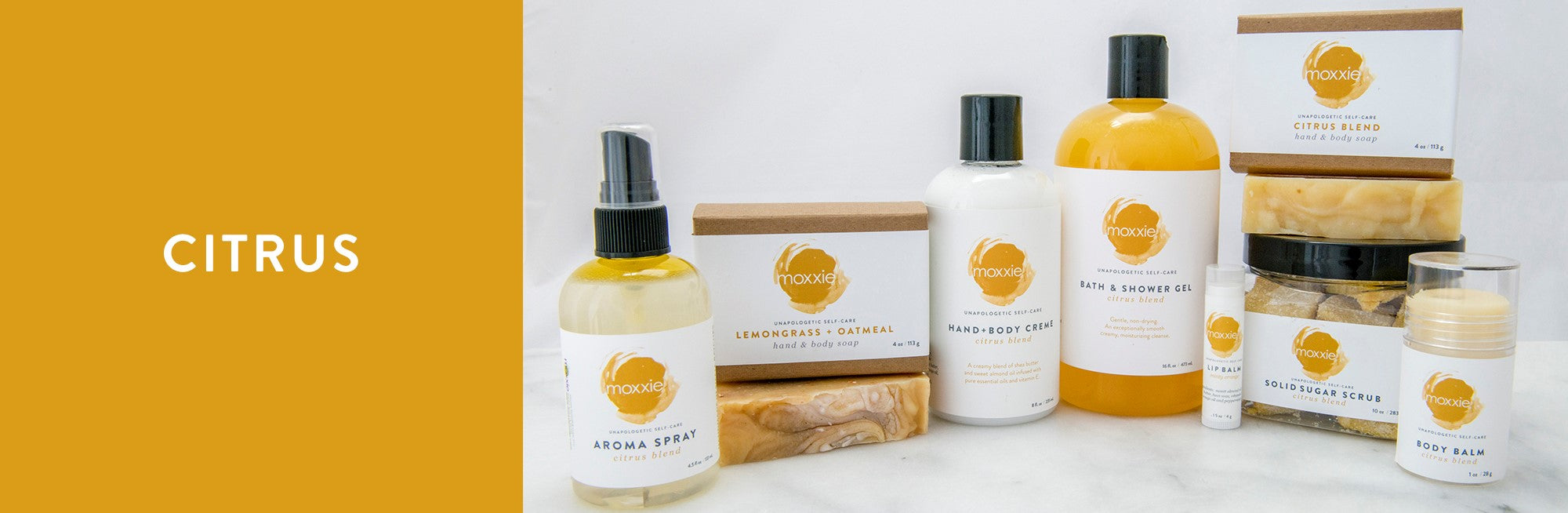 MOXXIE Citrus collection of handcrafted bath and body natural soaps, hand and body cremes, solid lotion body balms, solid sugar scrub cube and aroma sprayss,