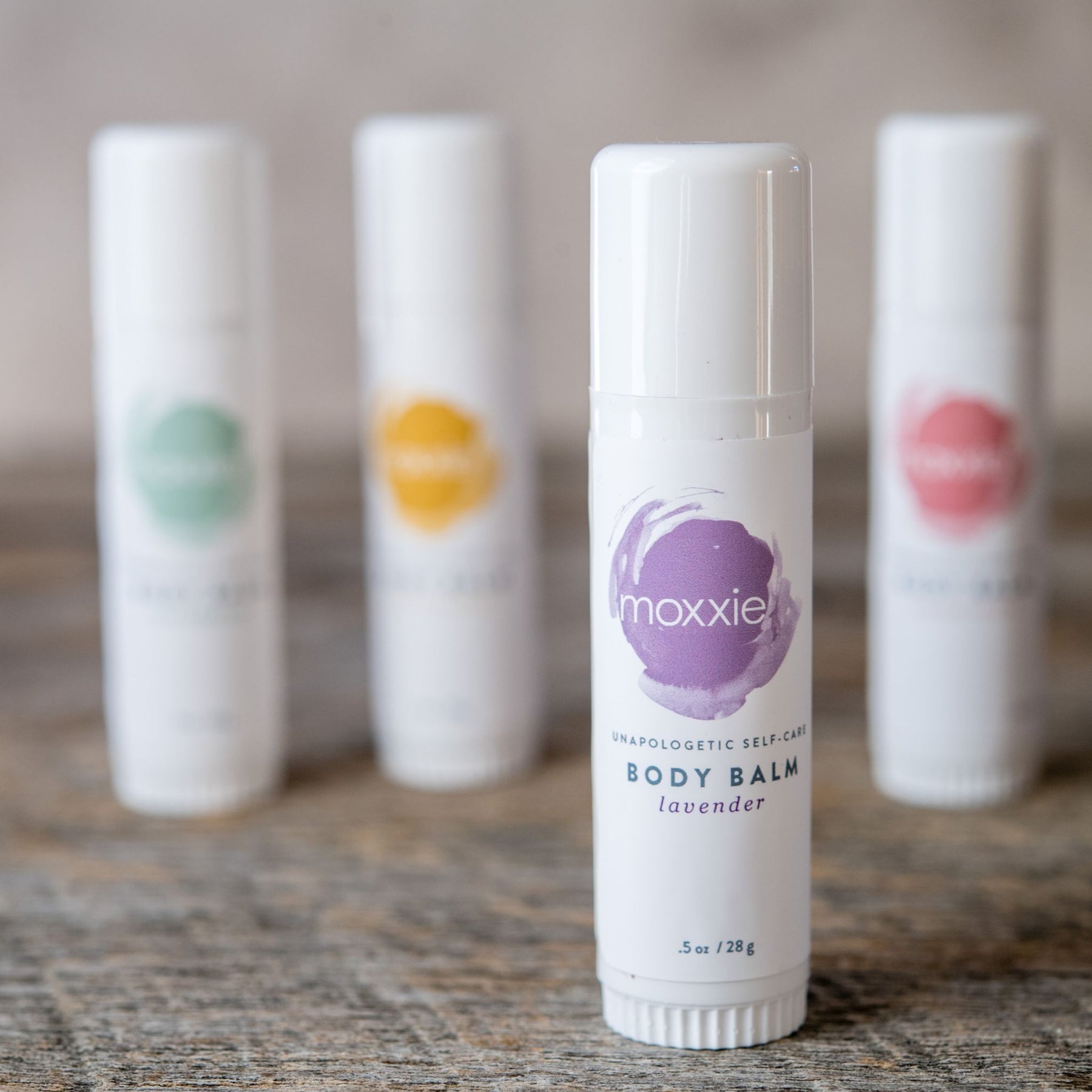 Moxxie's all natural, handcrafted, lavender solid lotion body balm in a convenient push up stick.