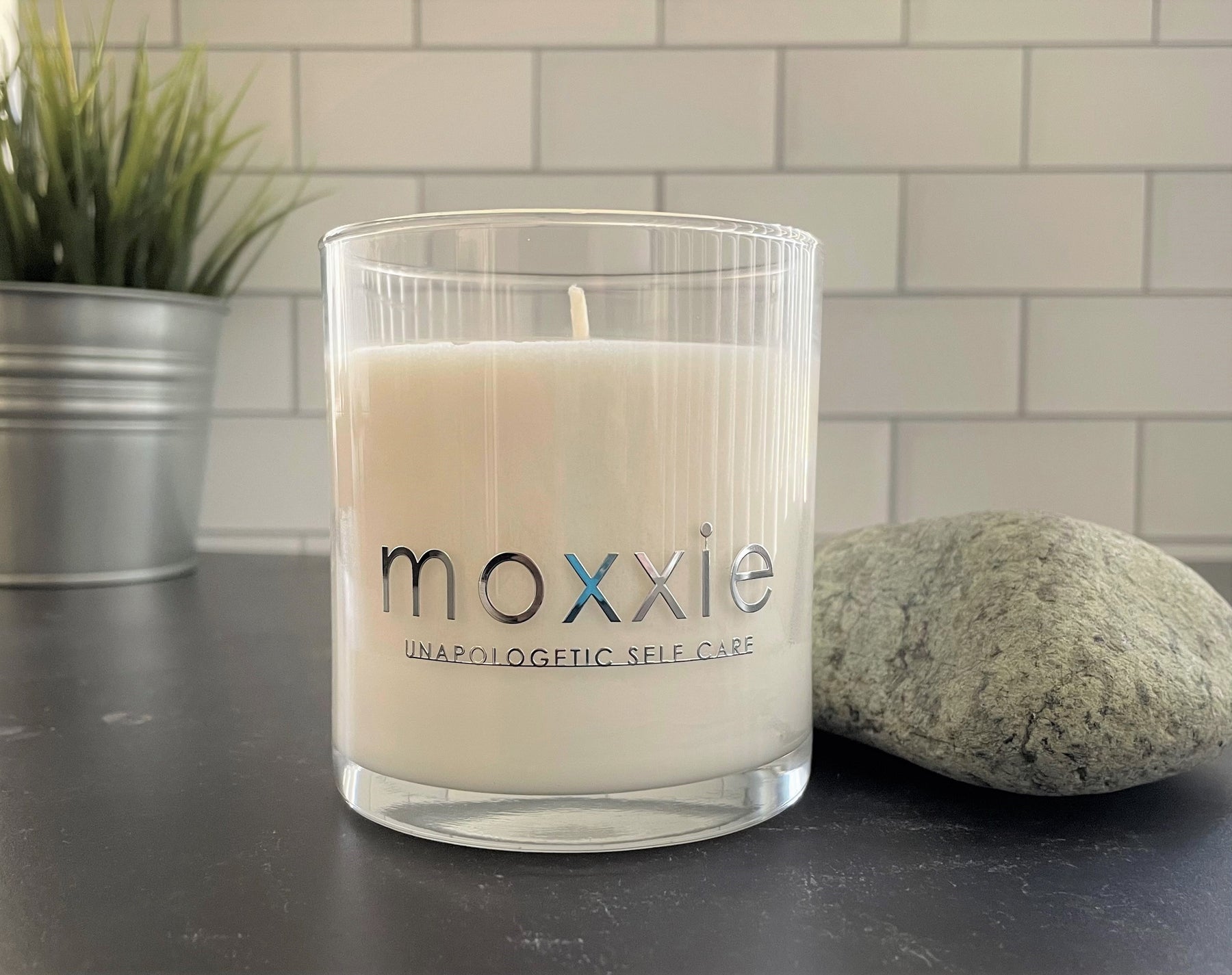 Moxxie Essential Care hand-poured candle made from 100% soy wax with a cotton fiber lead-free wick and honestly fragranced with a blend of pure essential oils.