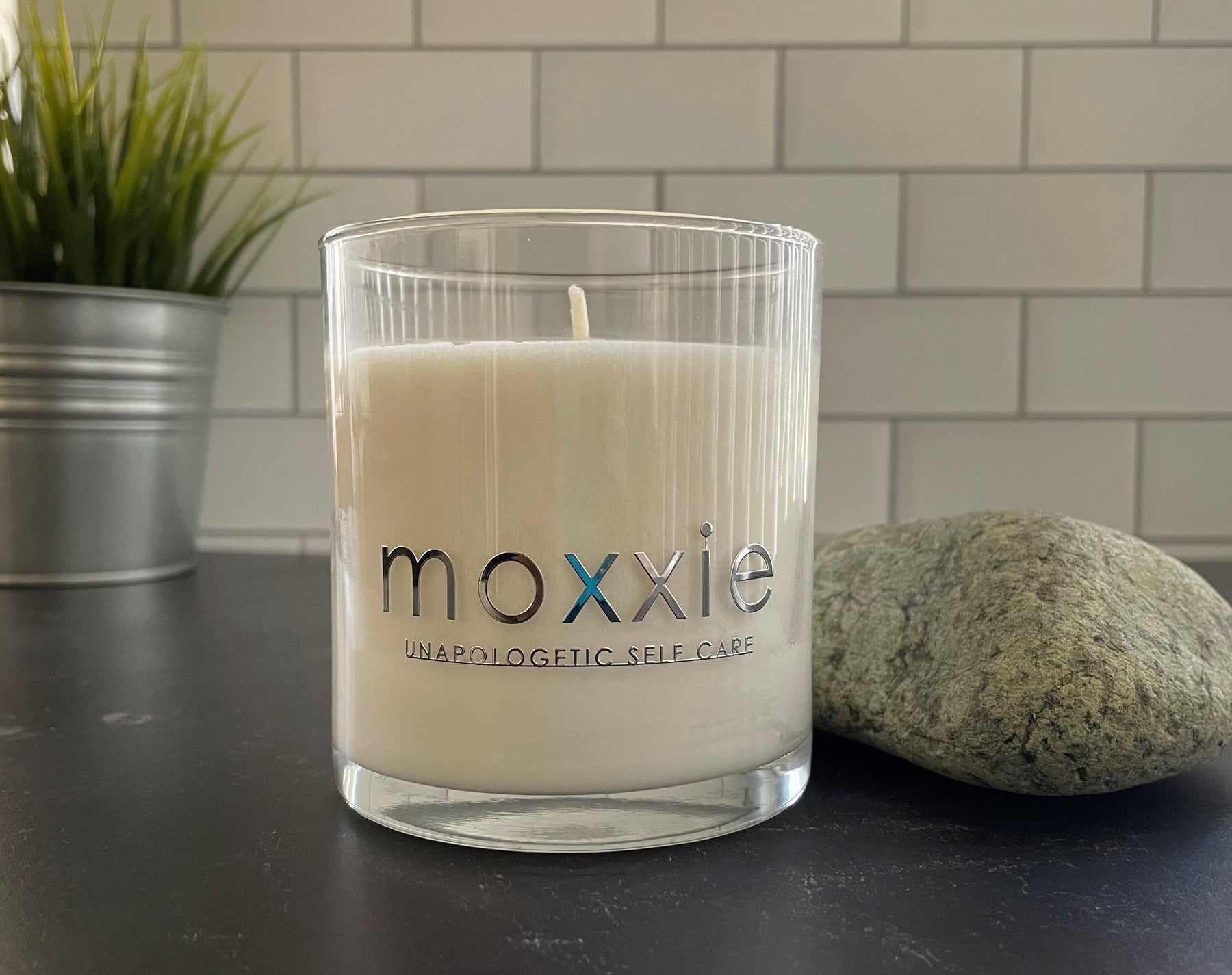 Moxxie Essential Care hand-poured candle made from 100% soy wax with a cotton fiber lead-free wick and honestly fragranced with a blend of pure essential oils.