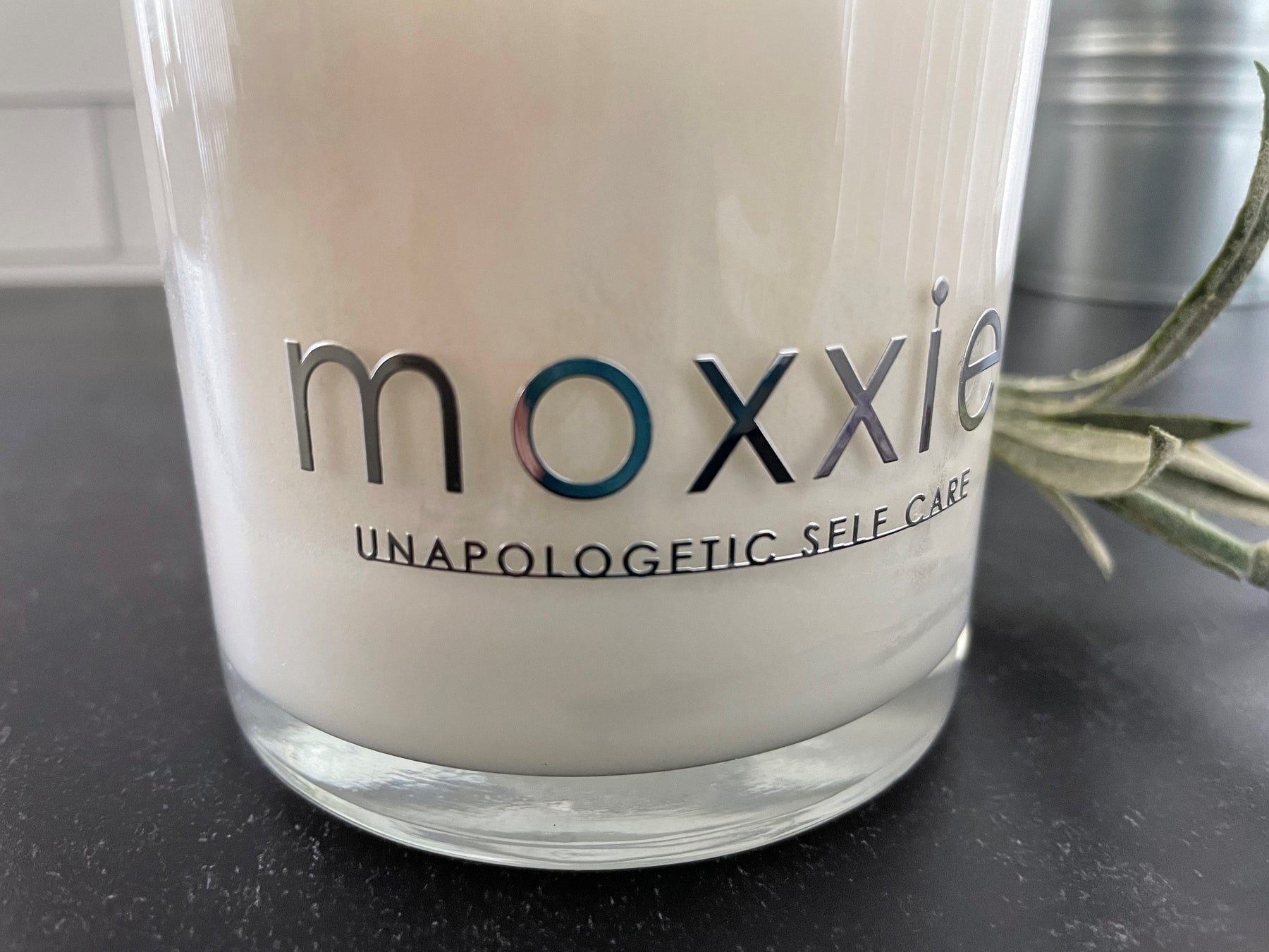 Moxxie Essential Care hand-poured candle made from 100% soy wax with a cotton fiber lead-free wick and honestly fragranced with a blend of pure essential oils.