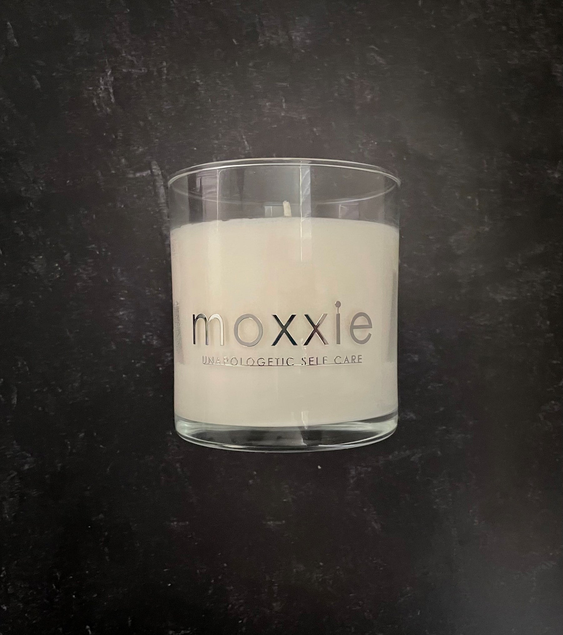 Moxxie Essential Care hand-poured candle made from 100% soy wax with a cotton fiber lead-free wick and honestly fragranced with a blend of pure essential oils.