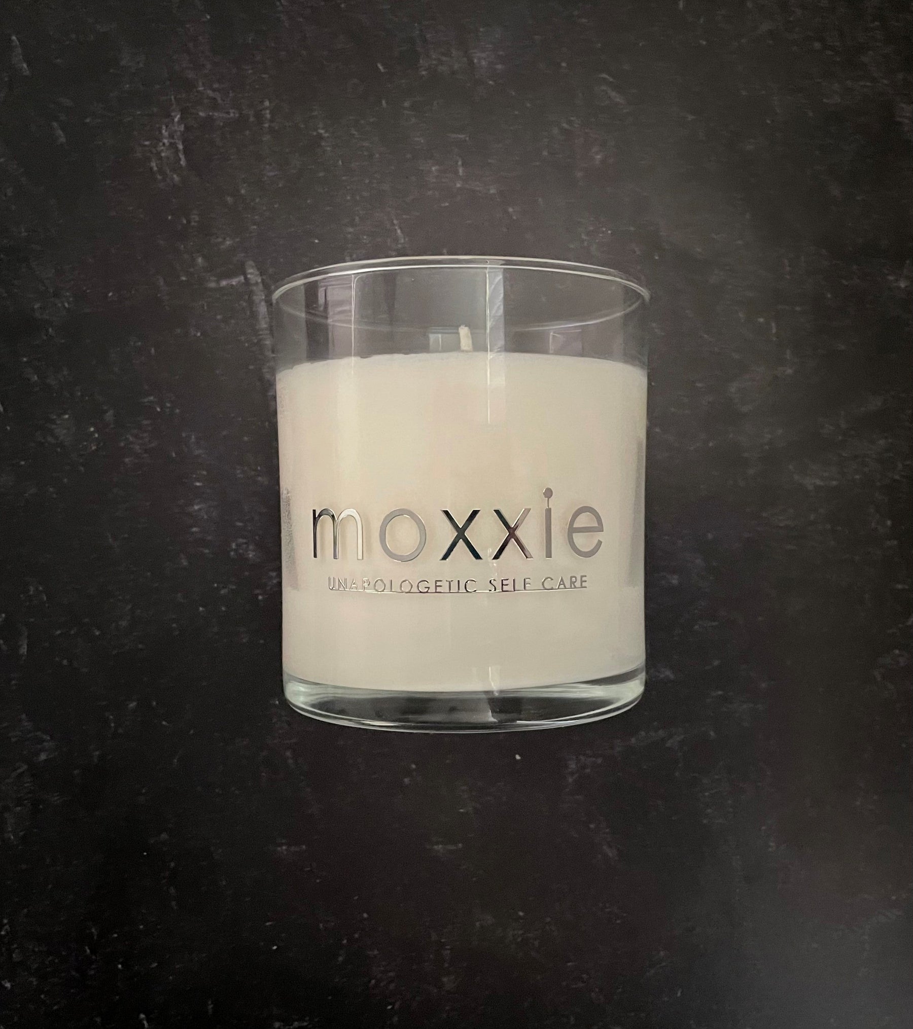Moxxie Essential Care hand-poured candle made from 100% soy wax with a cotton fiber lead-free wick and honestly fragranced with a blend of pure essential oils.