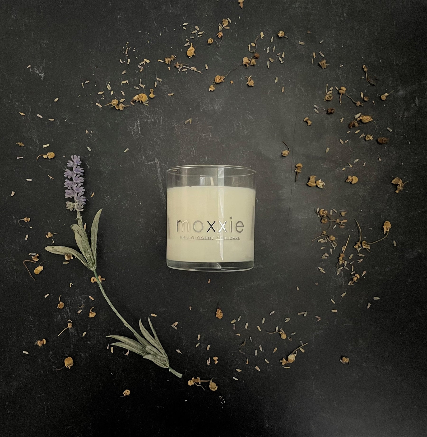 Moxxie Essential Care hand-poured candle made from 100% soy wax with a cotton fiber lead-free wick and honestly fragranced with a blend of pure essential oils.