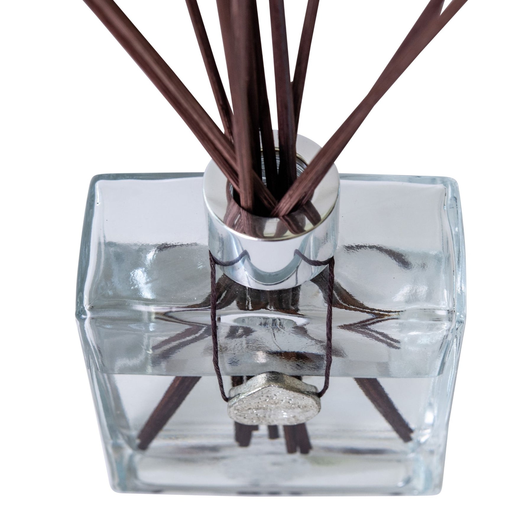 Clear diffuser bottle with all natural fragrance and reed stems.  Handcrafted by Moxxie.