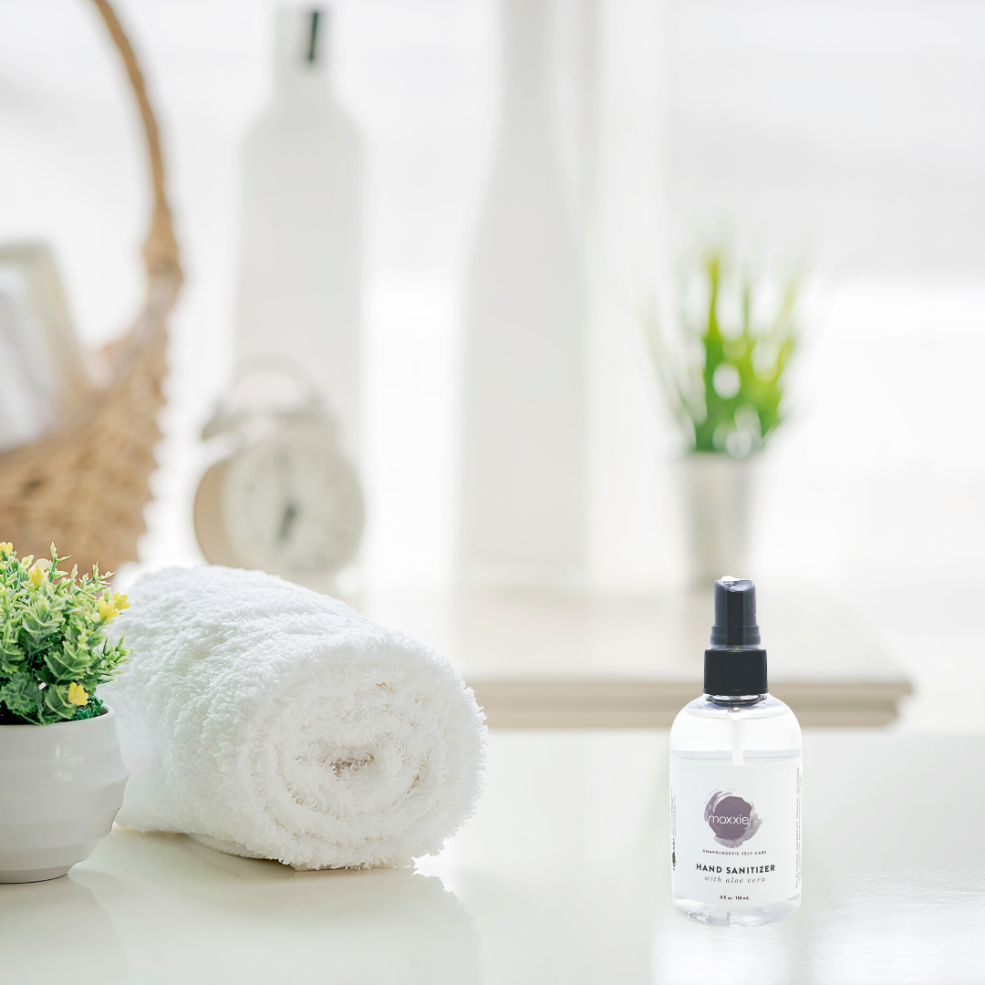 Moxxie's convenient hand sanitizer spray on the counter of a spa for easy use.