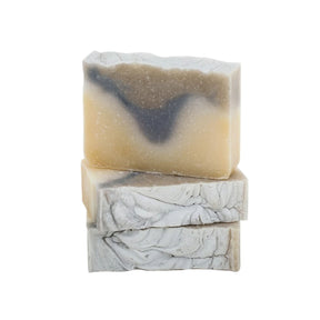 Stack of Lavender and Eucalyptus bar soaps, showing their marbled tan, blue and cream textures