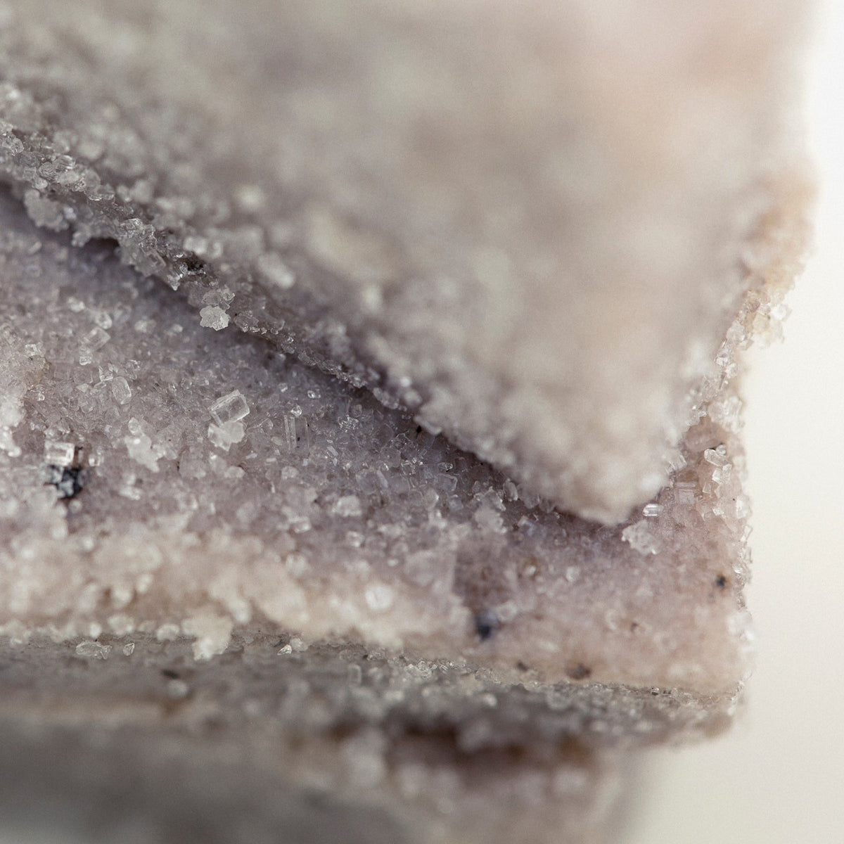 Close up of Lavender sugar scrub cube showing it's delicate purple color and sugary texture